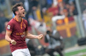 AS Roma's Alessandro Florenzi celebrates after scoring the 1-0 during the Serie A soccer match between AS Roma and Genoa at the Olimpico stadium in Rome, Italy, 12 January 2014.  ANSA/ETTORE FERRARI